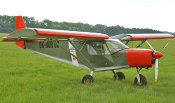 STOL CH 701 in a grass field