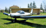 ZODIAC CH 601 parked in front of a custom homemade hangar