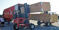 Unloading crated Quick Build Kits (shipped in a 40-ft. container).